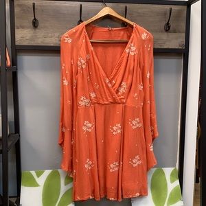 Free people coral with ivory embroidered detail. Size 2 fully lined.